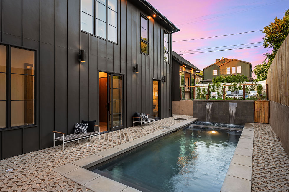 modern backyard with a sleek pool and water feature