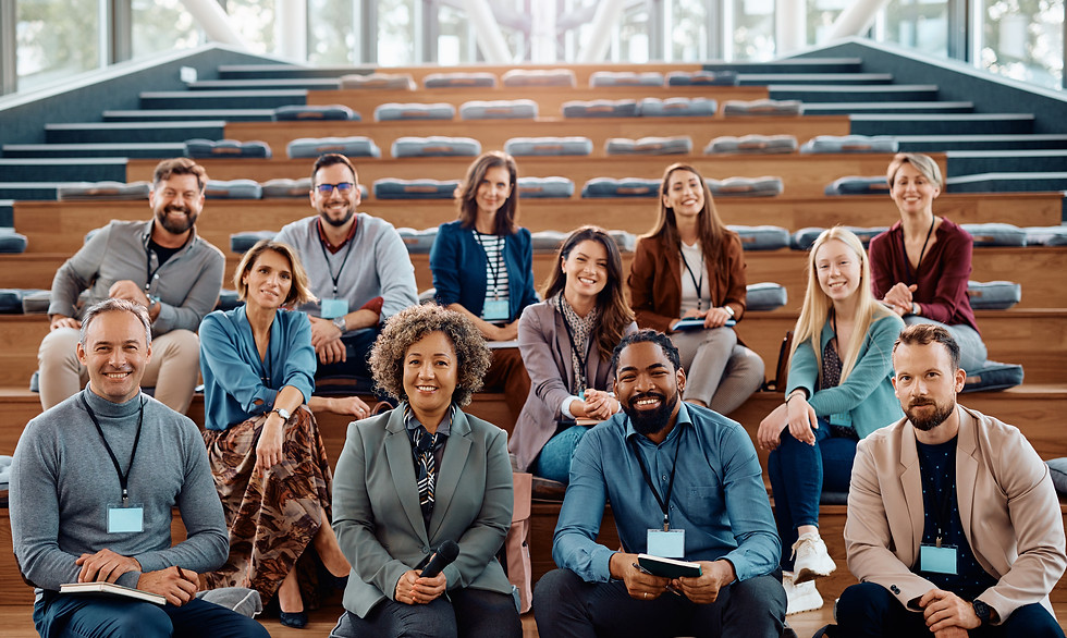 multiracial group of happy business attending seminar